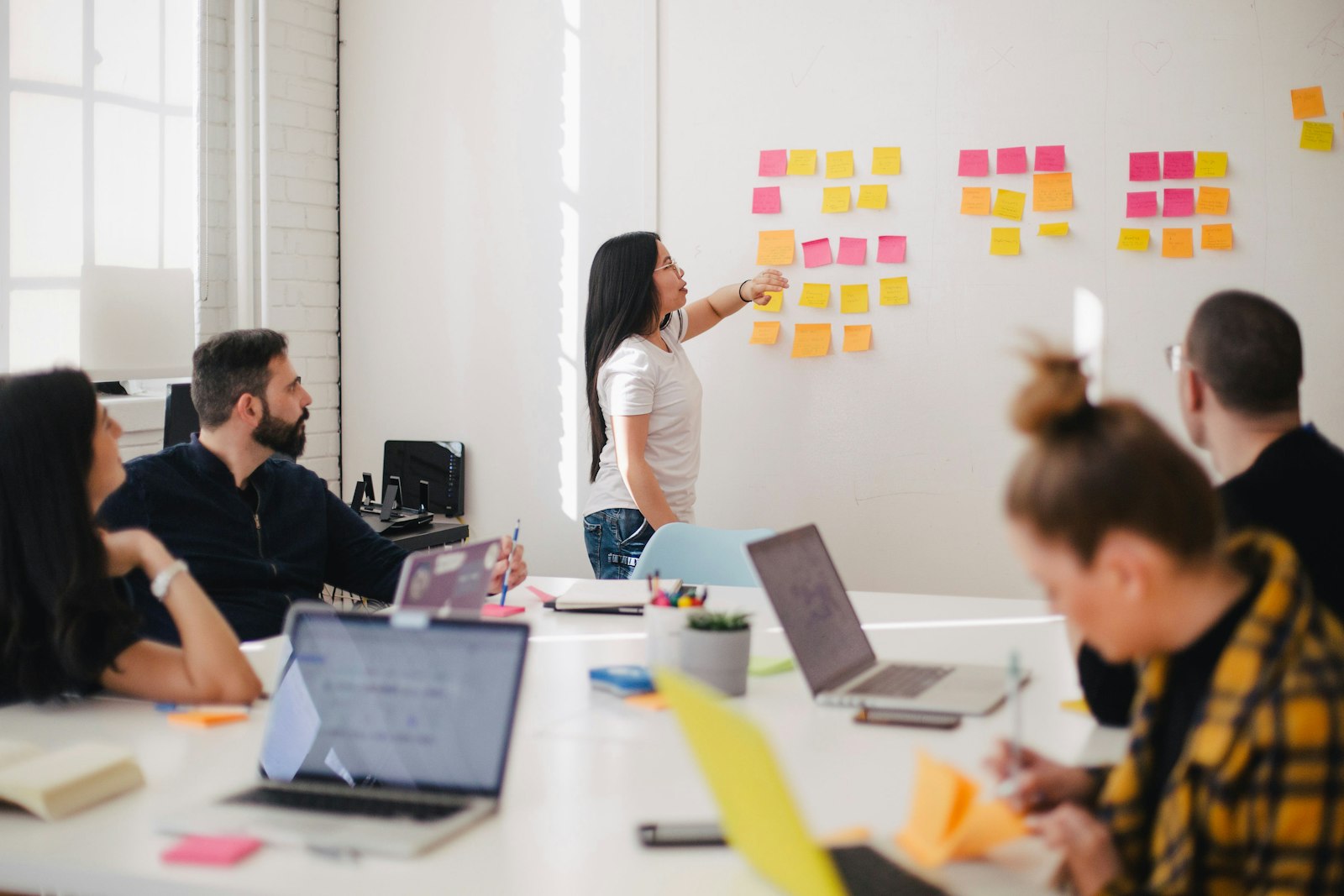Consulting team discussing claims architecture in a workshop